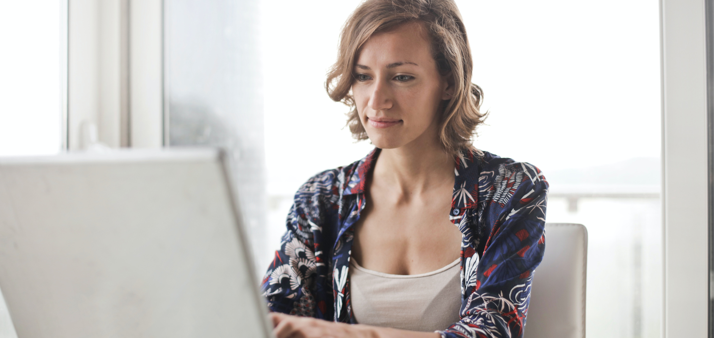 Woman sitting on laptop