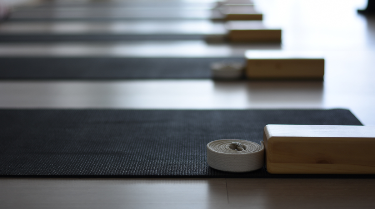 photo of empty yoga class and yoga equipment