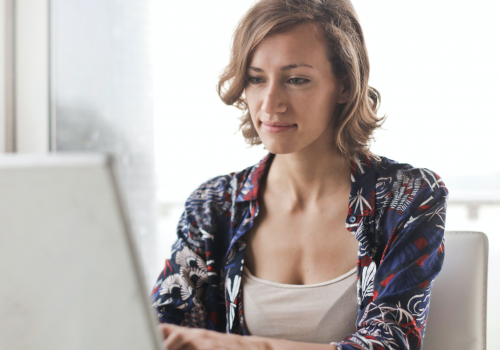 Woman sitting on laptop